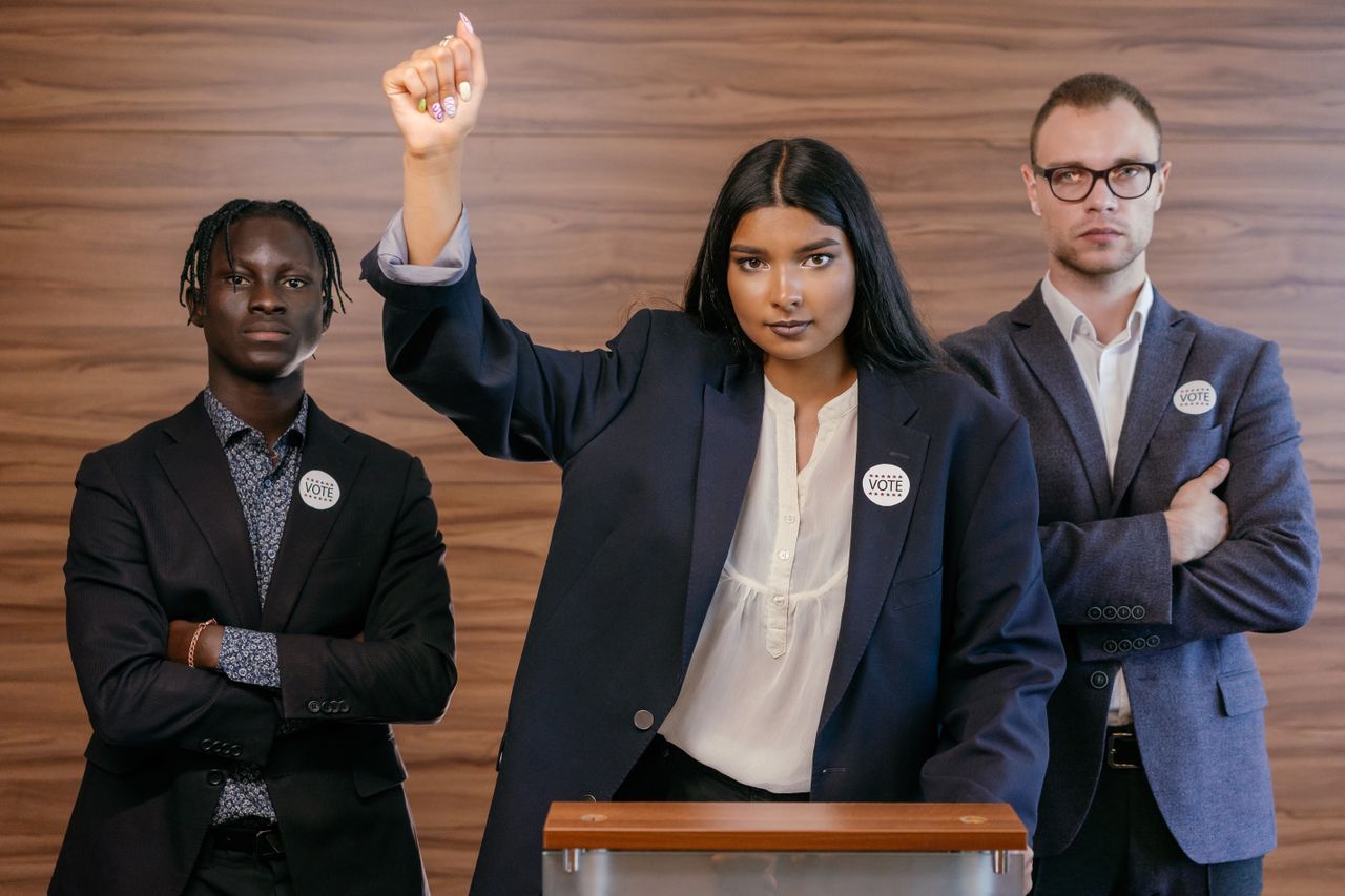 creative-02 Determined political leaders standing together, promoting voter engagement.